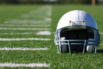 American football helmet on field