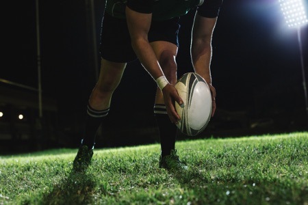 Rugby player dropping ball