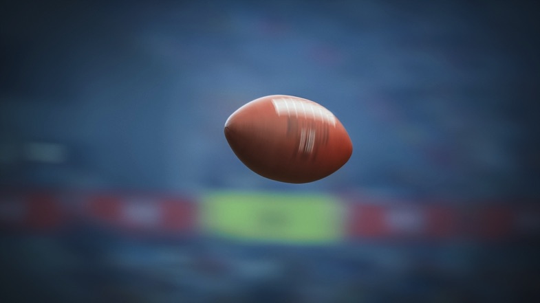 Football flying through air